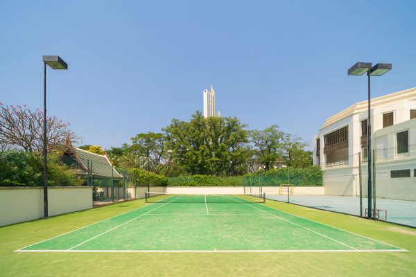 Empty tennis court with net, sport and recreation activity field ground in outdoor national stadium. Green arena. People lifestyle.